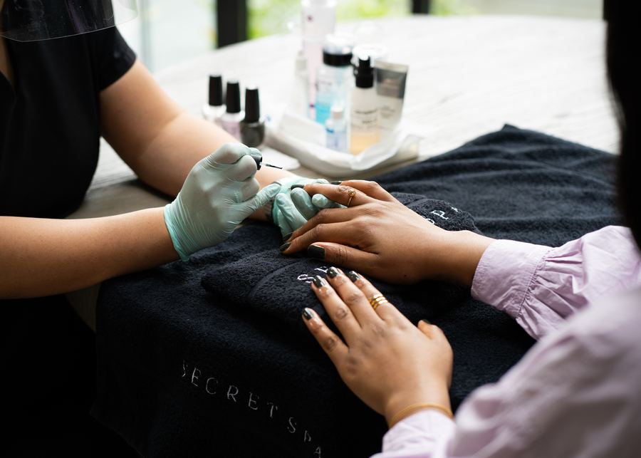 Secret Spa therapist carrying out a treatment